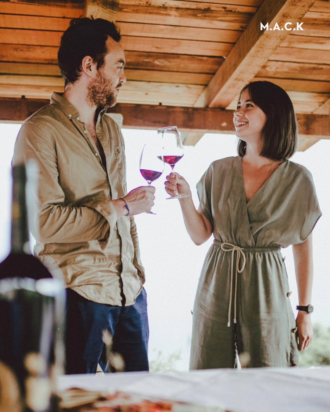 Couple toasting with wine at a Pelješac winery terrace